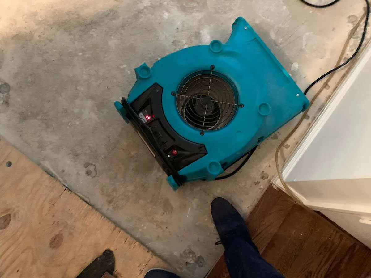 Air mover drying subfloor during Commercial Water Damage Restoration in Sugarland Run